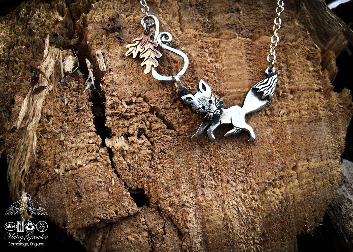 Handcrafted and recycled silver curious fox necklace made from silver coins