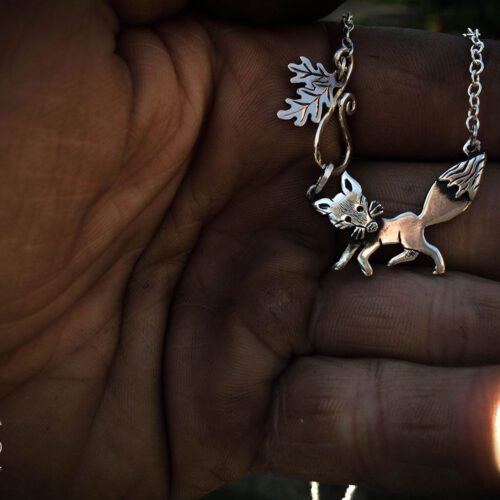 Handcrafted and recycled silver curious fox necklace made from silver coins