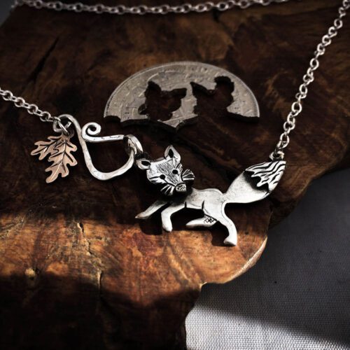 Handcrafted and recycled silver curious fox necklace made from silver coins