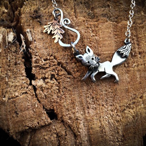 Handcrafted and recycled silver curious fox necklace made from silver coins
