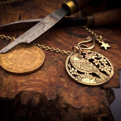 Handmade and completely upcycled and repurposed Goldfinch necklace totally handcrafted and recycled from old 22ct solid gold sovereign coins. Designed and created by Hairy Growler Jewellery, Cambridge, UK.
