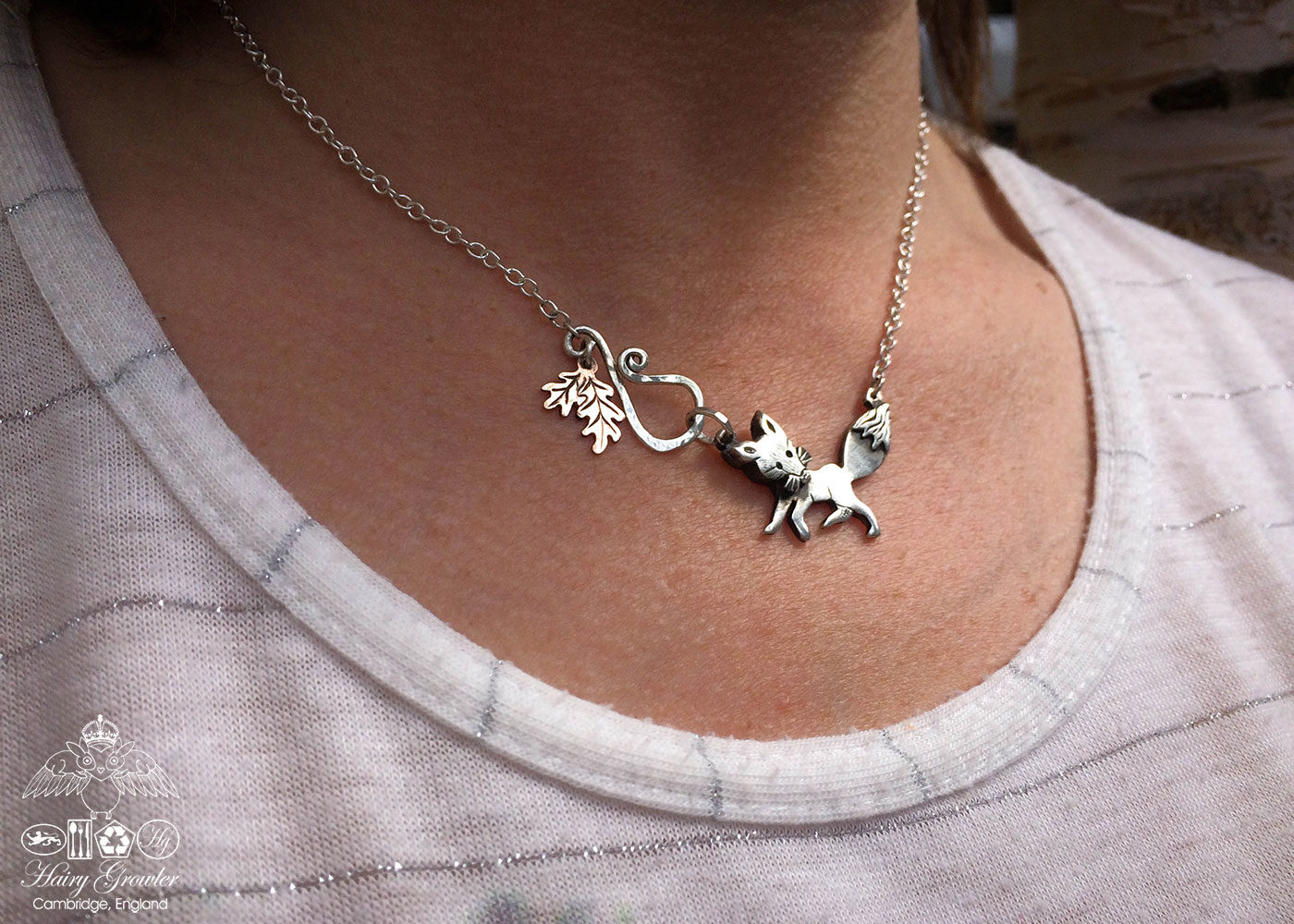 Handmade and upcycled silver curious fox necklace made from silver coins