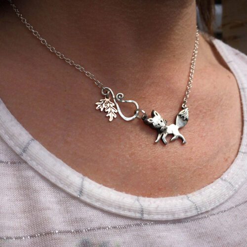 Handmade and upcycled silver curious fox necklace made from silver coins