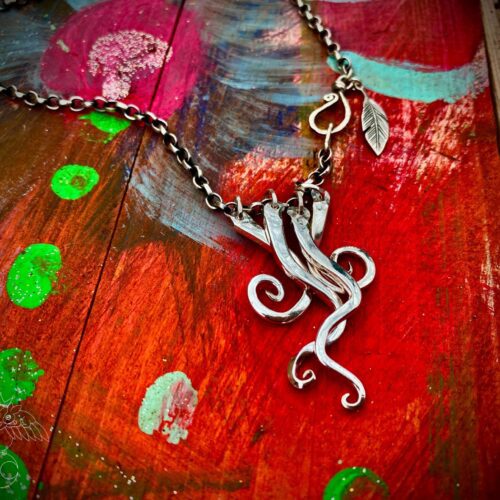 Handcrafted and recycled antique dessert fork necklace