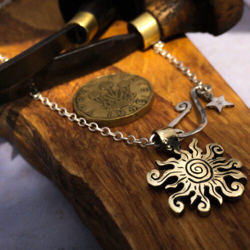 handmade bronze sun charm for a tree sculpture, necklace or bracelet