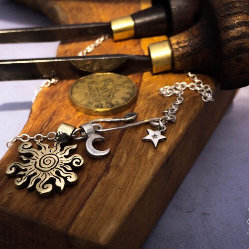 handmade bronze sun charm for a tree sculpture, necklace or bracelet