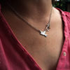 handcrafted and upcycled silver coin love, peace and outerness dove necklace