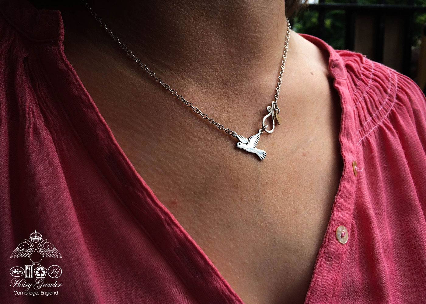 handcrafted and upcycled silver coin love, peace and outerness dove necklace