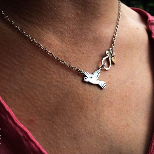 handmade and recycled silver coin love, peace and outerness dove necklace