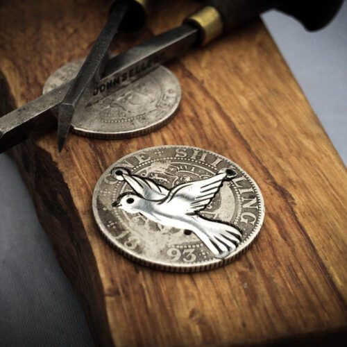 handcrafted and recycled silver coin love, peace and outerness dove necklace