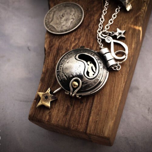 moonlight-leaping hare necklace handcrafted and recycled from three silver shilling coins all over 100 years old