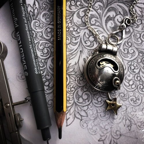 moonlight-leaping hare necklace handcrafted and recycled from three silver shilling coins all over 100 years old
