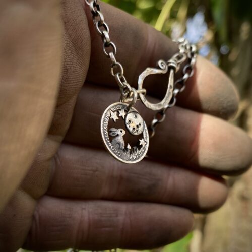 Moon gazing hare coin jewellery handmade, handcrafted using recycled silver coins and traditional hand tools and techniques. Combined with a love for nature, the natural world and our connection to it.
