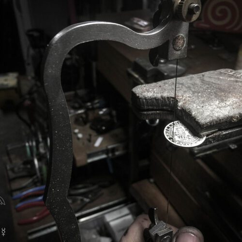 Handcrafted and recycled birthday shilling pendant