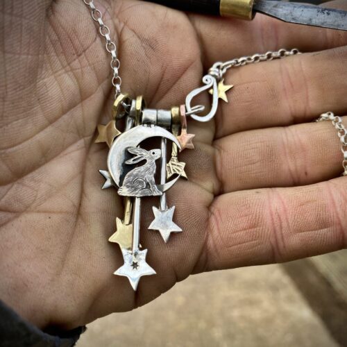 Moon hare jewellery handmade and recycled silver coin necklace made in an independent artisan workshop studio