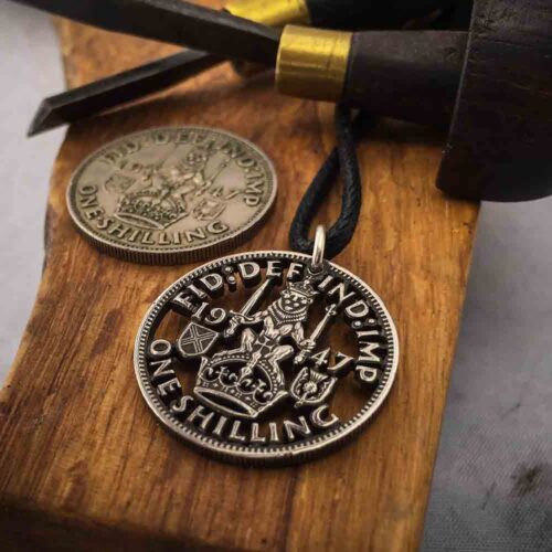 Handcrafted and recycled birthday shilling pendant