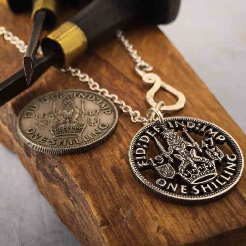 Handcrafted and recycled birthday shilling pendant