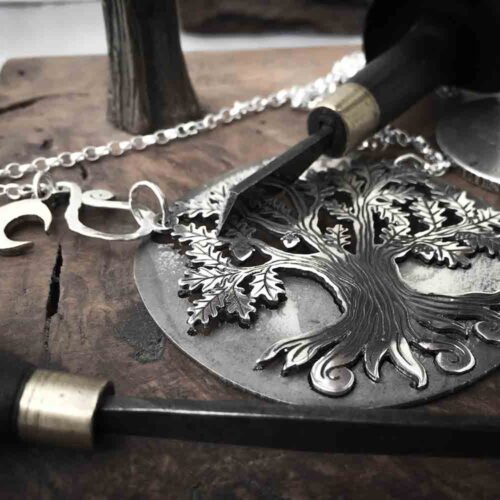 Handcrafted and recycled silver ancient woodland Tree of Life necklace made from a silver crown coin