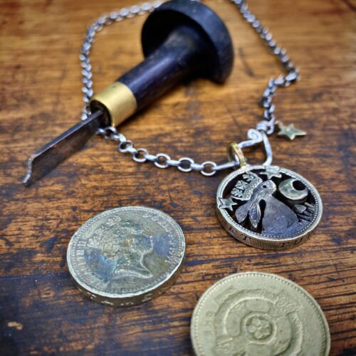 prince rainbow watership down inspired coin pendant