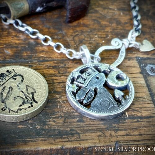 prince rainbow watership down inspired coin pendant