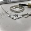 Claddagh jewellery - handmade and ethical silver Florin coin. The Hairy Growler Love collection. Handcrafted and repurposed Victorian silver Florin Claddagh necklace by Hairy Growler.