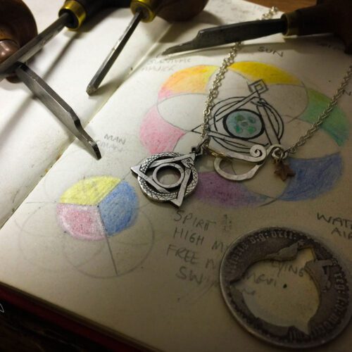 Handcrafted and repurposed coin magical earth realm pendant necklace