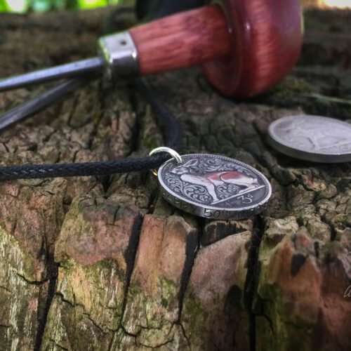 hand carved flourish Irish hare threepence coin pendant with hand carved massage on the edge