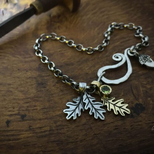 Silver charm bracelet handcrafted and recycled for the tree of life sculpture collection
