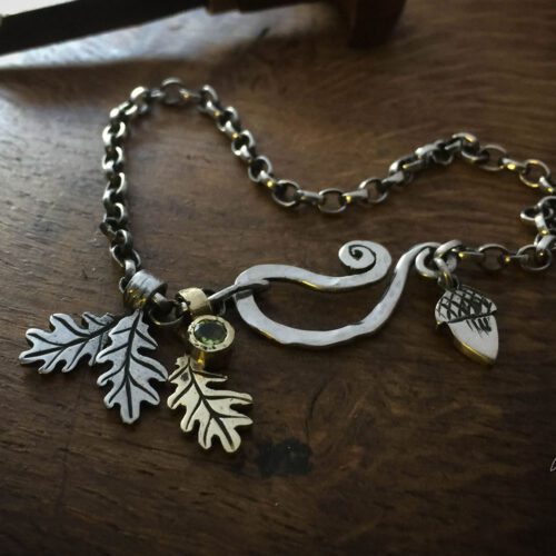 Silver charm bracelet handcrafted and recycled for the tree of life sculpture collection