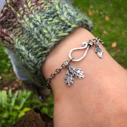 Silver charm bracelet handcrafted and recycled for the tree of life sculpture collection