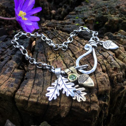 Silver charm bracelet handcrafted and recycled for the tree of life sculpture collection