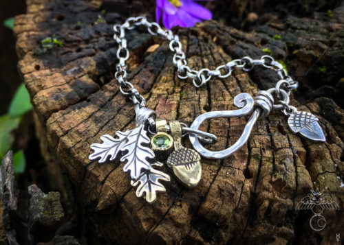 Silver charm bracelet handcrafted and recycled for the tree of life sculpture collection
