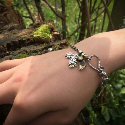 Silver charm bracelet handcrafted and recycled for the tree of life sculpture collection