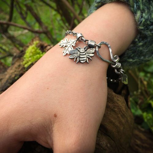 Silver charm bracelet handcrafted and recycled for the tree of life sculpture collection