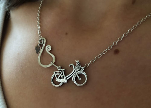 Bicycle necklace handcrafted and created with environmental awareness. Recycled silver coin jewellery made in Cambridge