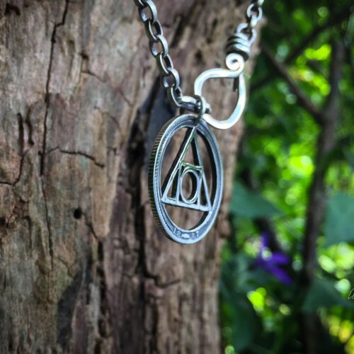 handcrafted and recycled silver shilling quintessence philosophers stone necklace