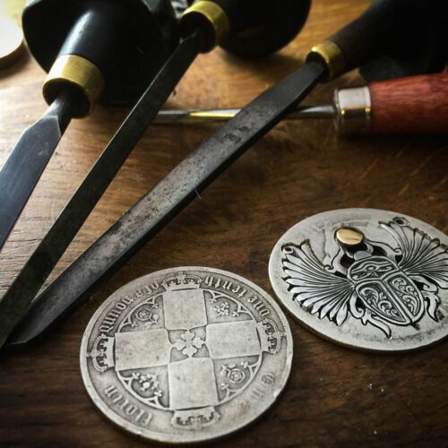 magical sacred winged scarab beetle necklace made from a silver coin. Handmade and upcycled in Cambridge