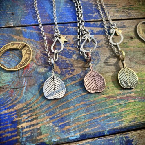 Ogham tree pendant handcrafted and recycled silver florin coin Alder leaf leaves necklace