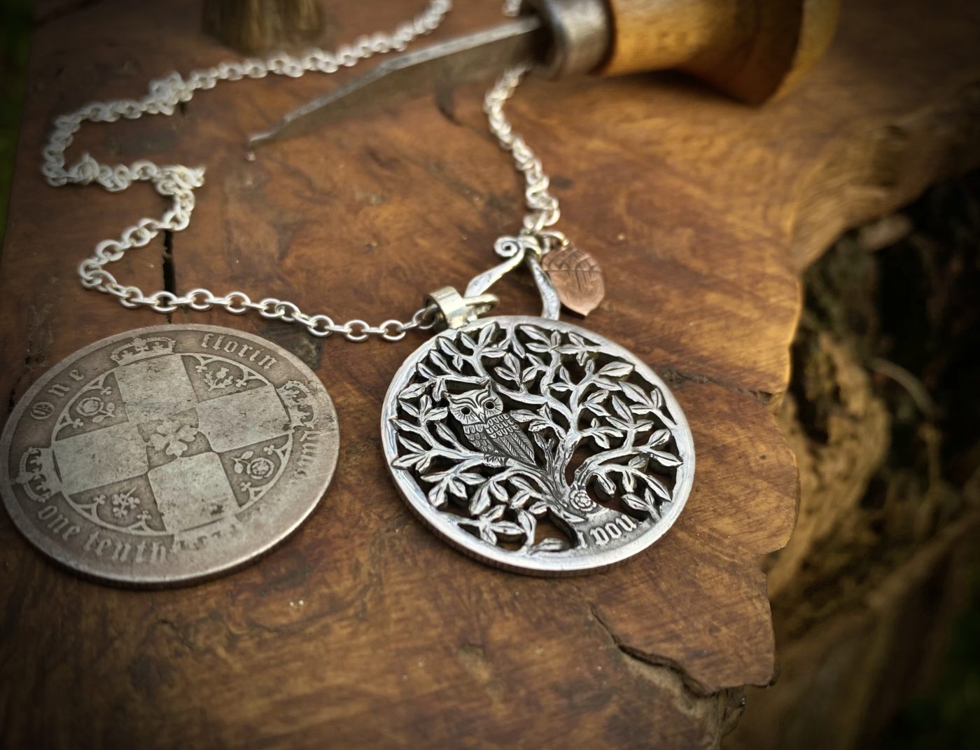 Tree of life silver coin necklace handcrafted and recycled ethical jewellery created at an artisan jewellery studio workshop in Cambridge, England. Eco-conscious, green and eco-friendly jewellery.
