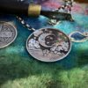 Moon gazing necklace handmade ethical jewellery created by independent jeweller Hairy Growler in Cambridge. Created entirely from recycled silver coins. Original hand carved and cut coin jewellery