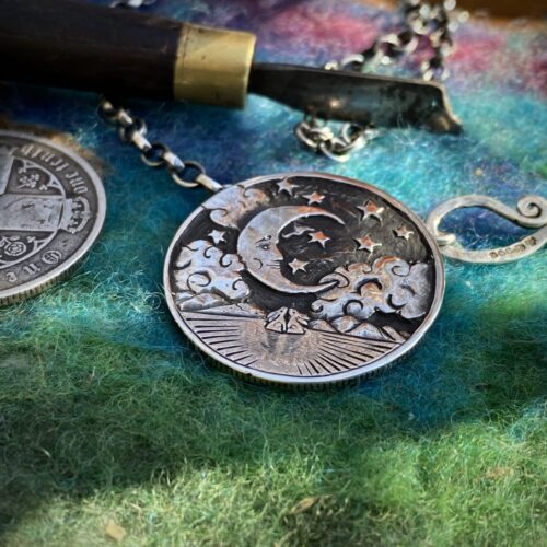 Moon gazing necklace handmade ethical jewellery created by independent jeweller Hairy Growler in Cambridge. Created entirely from recycled silver coins. Original hand carved and cut coin jewellery