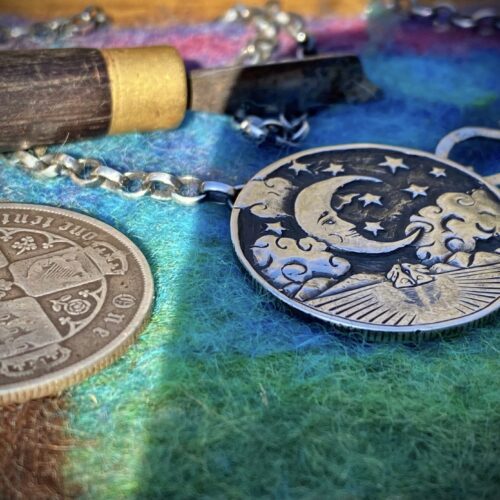 Moon gazing necklace handmade ethical jewellery created by independent jeweller Hairy Growler in Cambridge. Created entirely from recycled silver coins. Original hand carved and cut coin jewellery