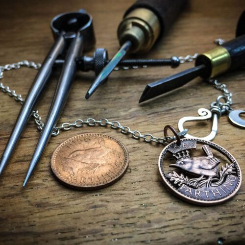 Jenny wren coin jewellery hand cut and carve by ethical jeweller Hairy Growler. Original handcrafted and recycled jewellery from an artisan studio independent workshop in Cambridge