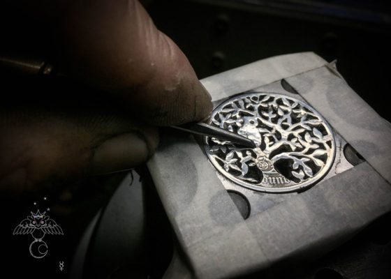 Tree of life silver coin necklace handcrafted and recycled ethical jewellery created at an artisan jewellery studio workshop in Cambridge, England. Eco-conscious, green and eco-friendly jewellery.