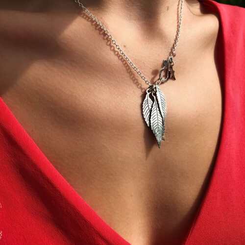 Ash tree leaves necklace - handcrafted and recycled ethical jewellery made from silver Victorian Florins.