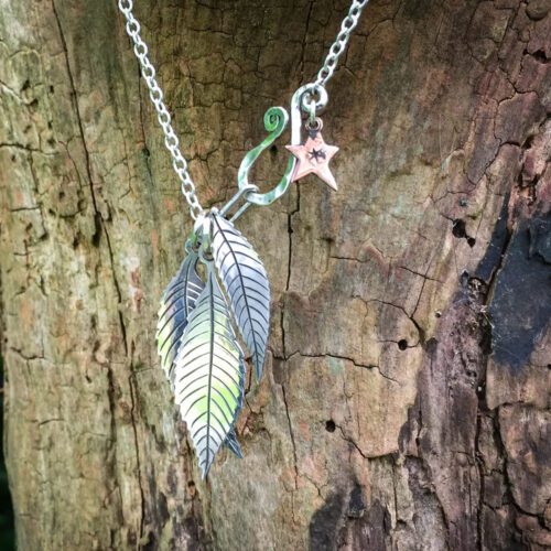 Ash tree leaves necklace - handcrafted and recycled ethical jewellery made from silver Victorian Florins.