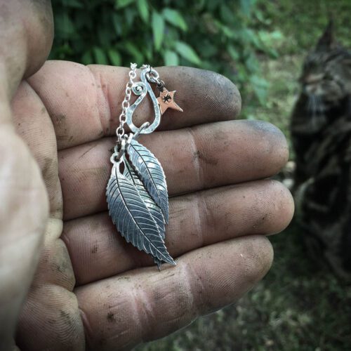 Ash tree leaves necklace - handcrafted and recycled ethical jewellery made from silver Victorian Florins.