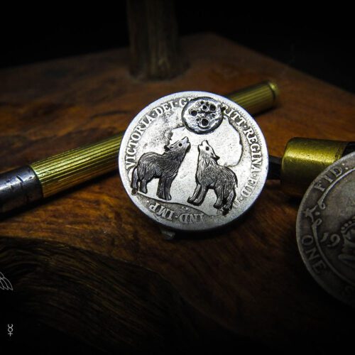 Wolf earrings - handmade and recycled sterling silver shilling coin.
