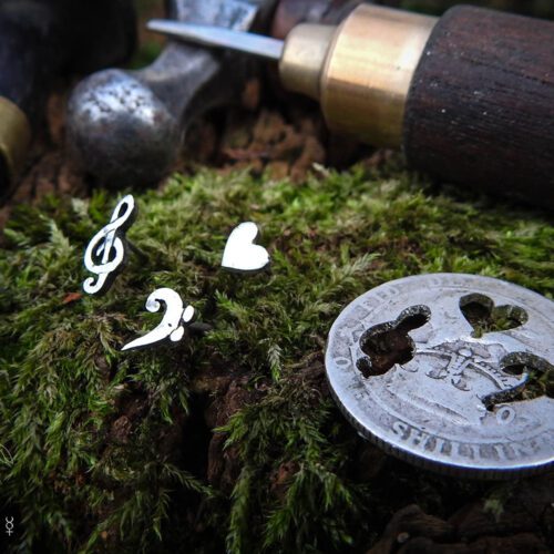 Musician earrings - handcrafted using traditional hand tools and techniques.  Handmade from recycled silver shillings.