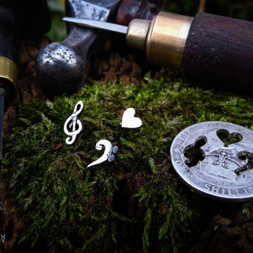 Musician earrings - handcrafted using traditional hand tools and techniques. Handmade from recycled silver shillings.